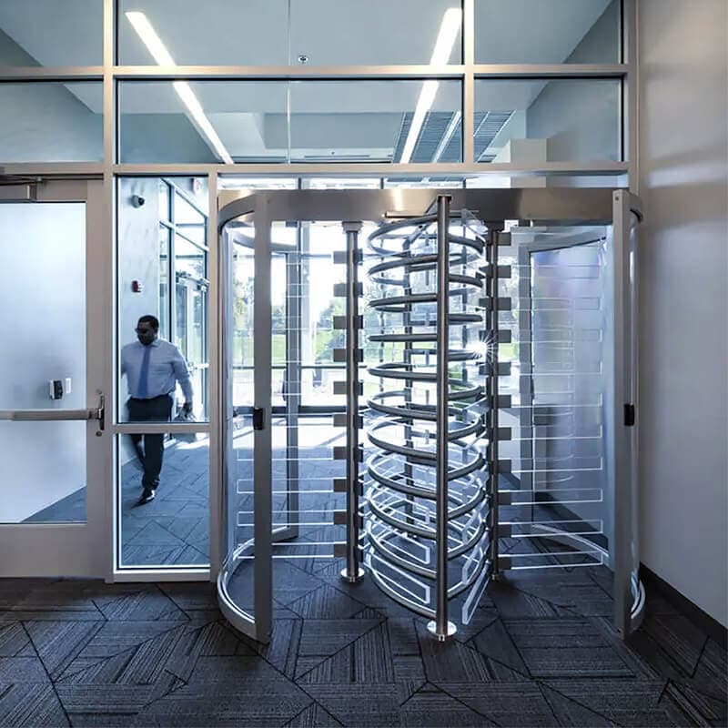 Rotating turnstile gate at a building entrance