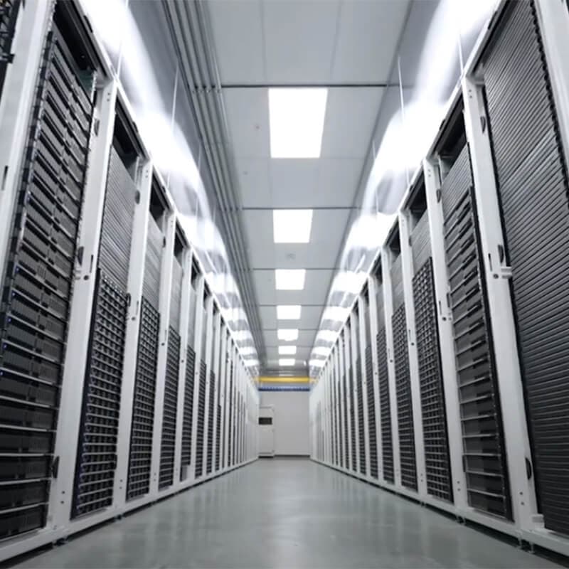 Hallway filled with data server stacks