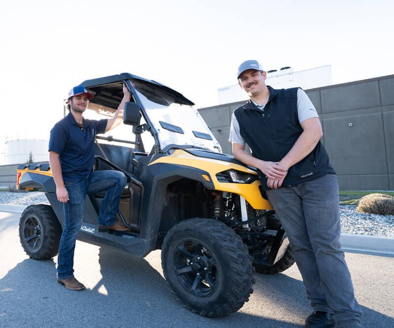 Two Sabey employees with a 4-wheel utility vehicle